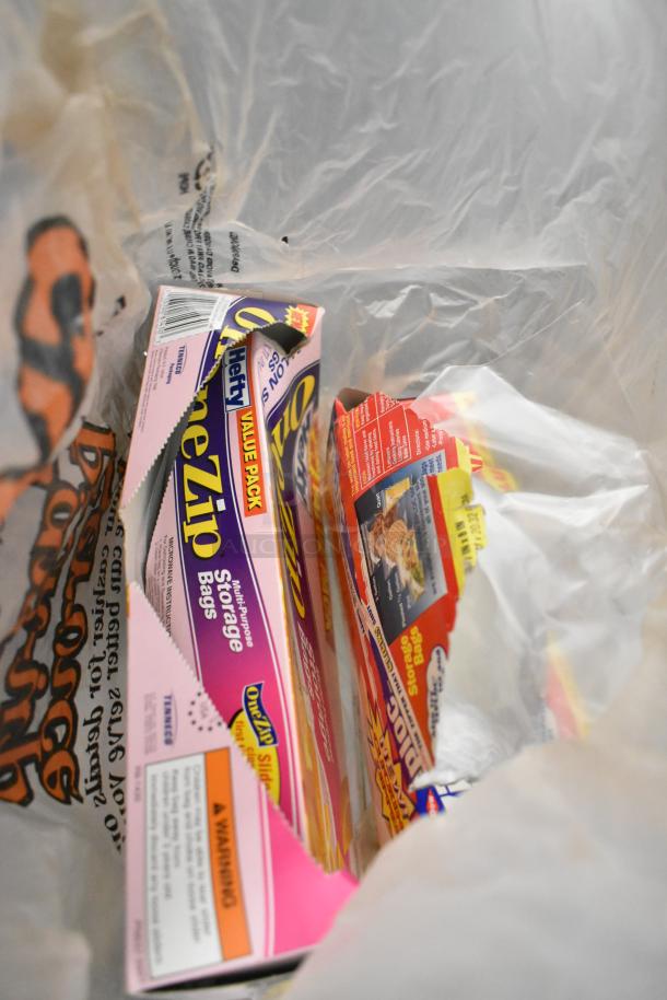 Assorted items including Hefty OneZip storage bags in a plastic bag, featuring value pack label and warning text.