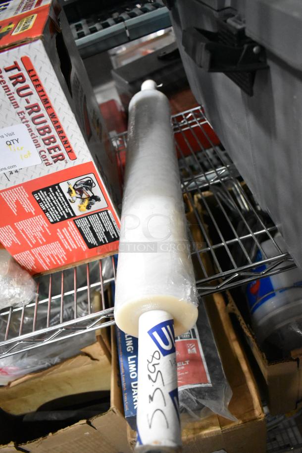 Tier lot including Tru Rubber extension cord box and gray poly toolbox on metal shelving. Items appear in used condition.