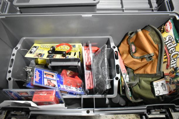 Gray poly tool box with Tru Rubber extension cord, assorted items, including a brown and green bag and SideCar box.