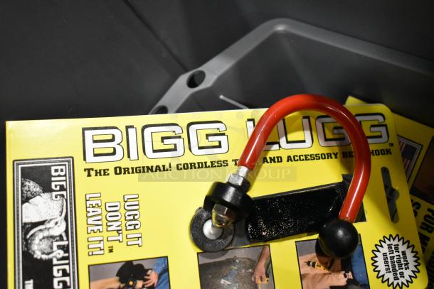 Auction lot includes Bigg Lugg tool holder, visible packaging text "The Original! Cordless Tool and Accessory Belt Hook."