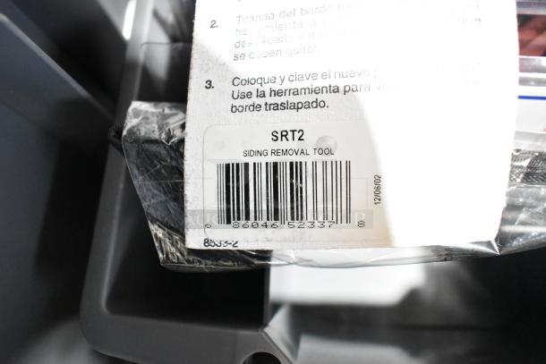 Auction lot image showing Tru Rubber extension cord, gray poly toolbox, and SRT2 siding removal tool with barcode.