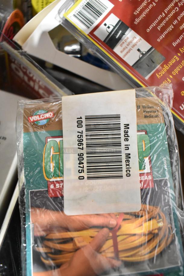 Tiered lot featuring a Tru rubber extension cord, Velcro packaging labeled "Made in Mexico," and a gray poly tool box.