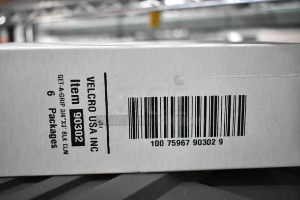 Box labeled "VELCRO USA INC", Item 90302, containing 6 packages, barcode visible, part of auction lot.