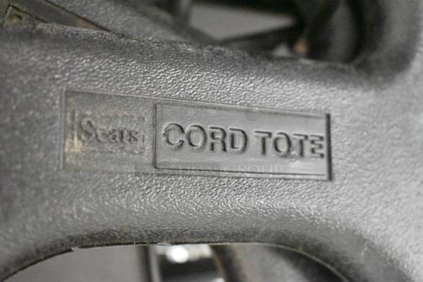 Sears Cord Tote marking on black textured surface, part of auction lot including Tru Rubber Extension Cord, Gray Poly Tool Box.