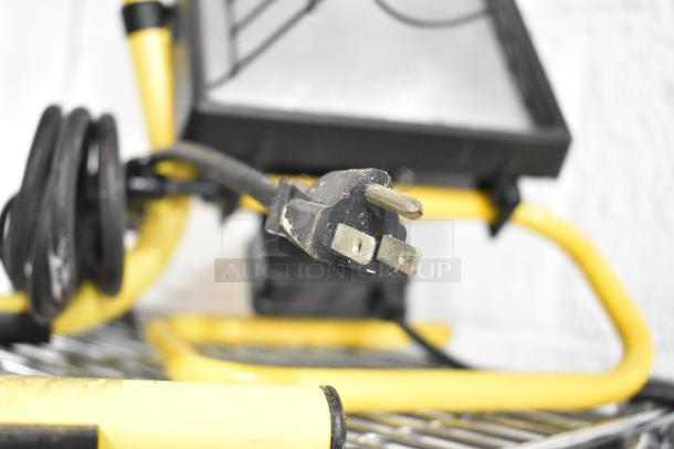 SM2262 magnetic base worklight with yellow frame and black plug, coiled cord. Visible wear on plug.
