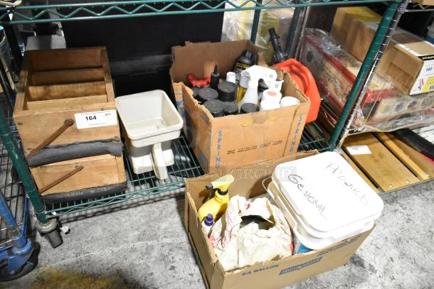 Tier lot of items including EZ Handspreader, nails, Sears air tool oil, misc. tools in boxes and bins on shelving unit.