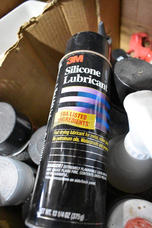 Auction lot featuring various items, including a 3M Silicone Lubricant can, fast-drying with FDA-listed ingredients.