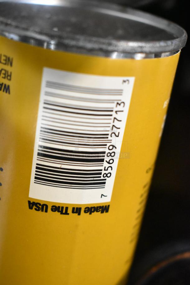 Yellow can with barcode and "Made in the USA" text, likely from the tier lot including EZ Handspreader, nails, and Sears oil.