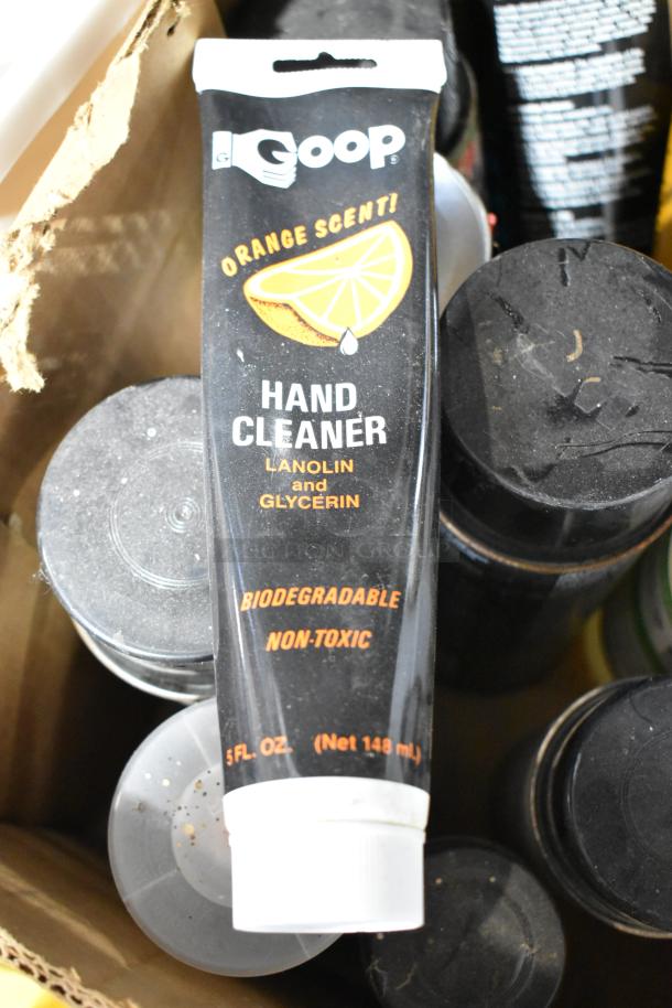 Tier lot with Goop hand cleaner, EZ handspreader, nails, and Sears lubricating oil; various conditions, biodegradable cleaner.
