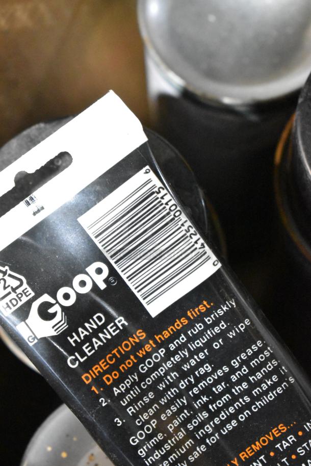 ALL ONE MONEY! tier lot featuring Goop hand cleaner with instructions, barcode visible, part of a mixed items collection.