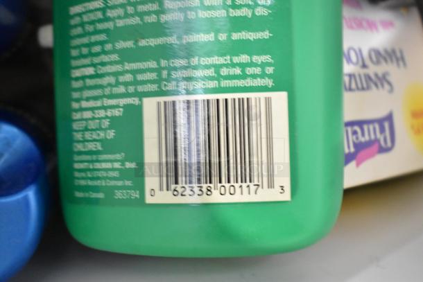 Tier lot of various items, visible: barcode on green cleaner bottle. Includes EZ Handspreader, nails, Sears Air Tool Oil.