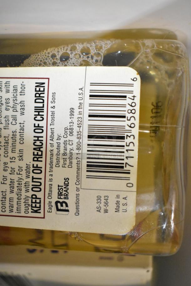 Close-up of Sears Air Tool Lubricating Oil's label, showing brand, barcode, and safety instructions. Made in USA.