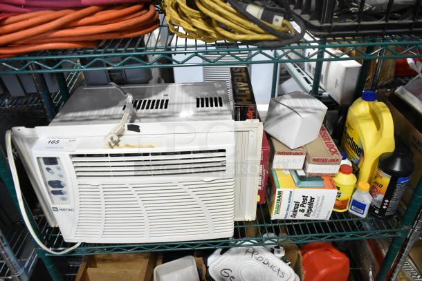 Tiered shelf with Maytag window air conditioner, Sure Sak liners, Weiser Lock keyed knobset, and assorted automotive fluids.