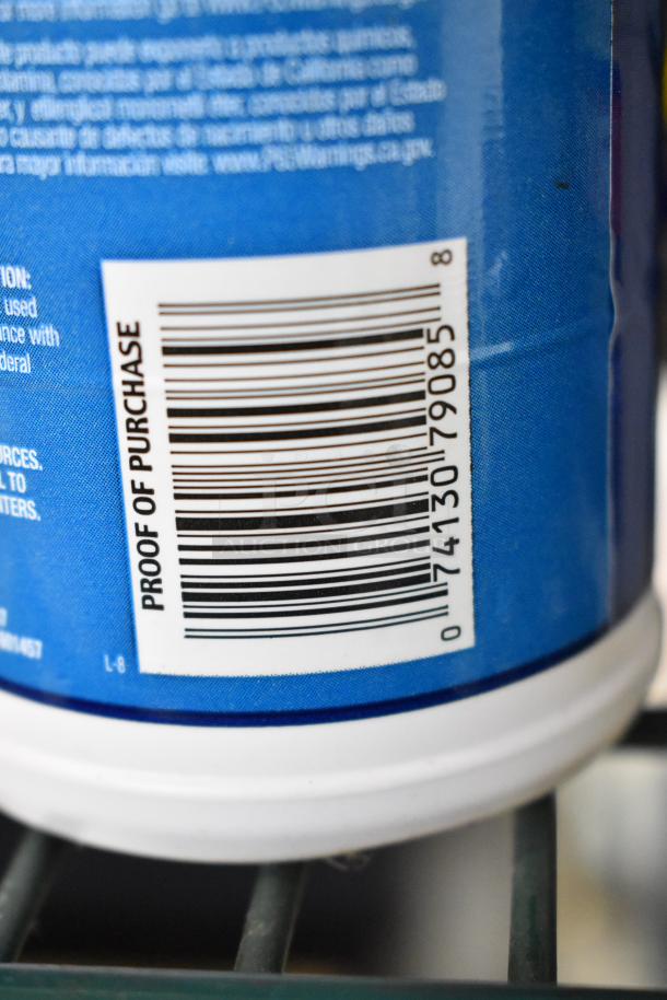 Barcode on a blue container with "Proof of Purchase" text. Item part of auction lot including air conditioner and other items.