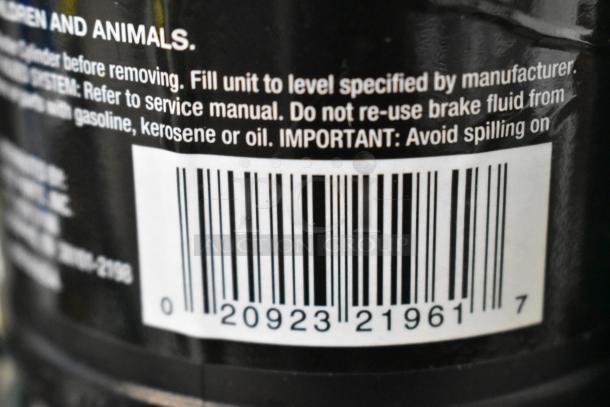 Barcode and cautionary text on a product label, advising against reusing brake fluid with other substances.