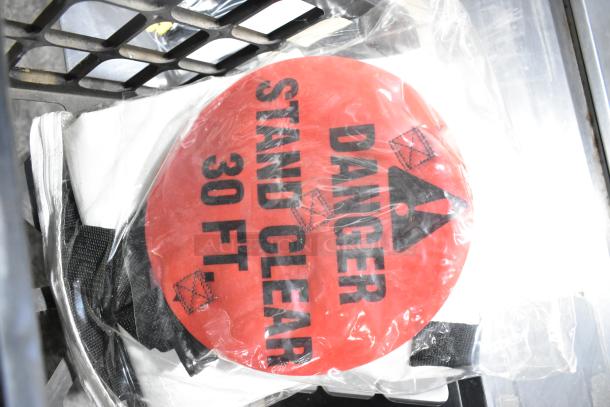 Tier lot with red "Danger Stand Clear 30 FT" sign, extension cords, Security Plus System 1000 in good condition.