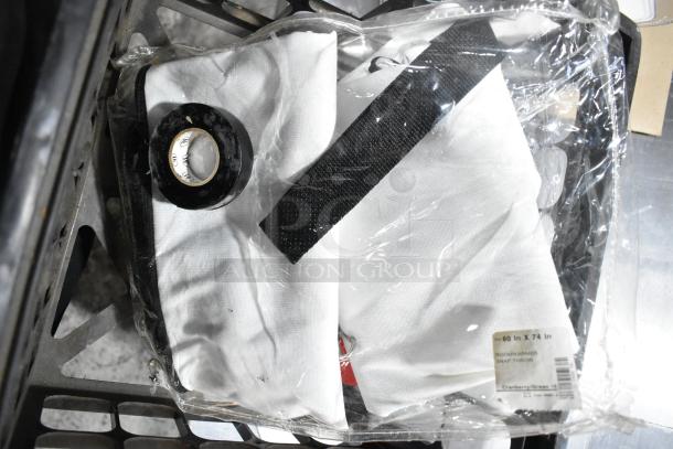 "Tier lot of assorted items including extension cords and Security Plus System 1000 alarm. Includes labeled fabric pieces."