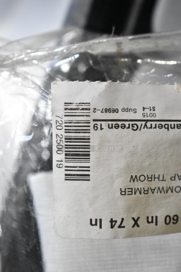 Auction lot with extension cords and Security Plus System 1000 alarm, featuring a labeled transparent package.