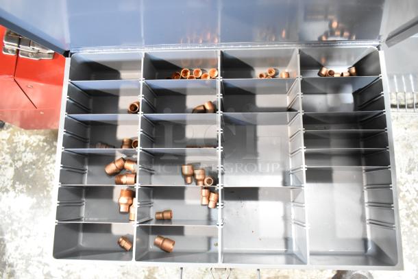 Gray metal 4 drawer hardware box with multiple compartments, filled with copper fittings. Sturdy and in good condition.