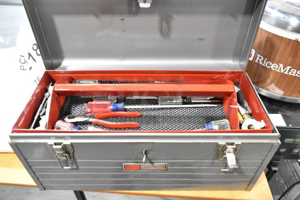 Craftsman gray metal tool box with various tools, featuring locking latches and red interior tray. Good condition.