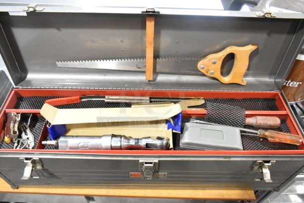 Craftsman gray metal tool box with various hand tools including a handsaw, screwdriver, and ratchet. Well-organized contents.