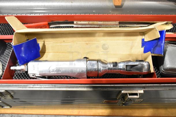 Craftsman gray metal tool box with assorted tools, including a pneumatic ratchet. Box in good condition with latch closed.