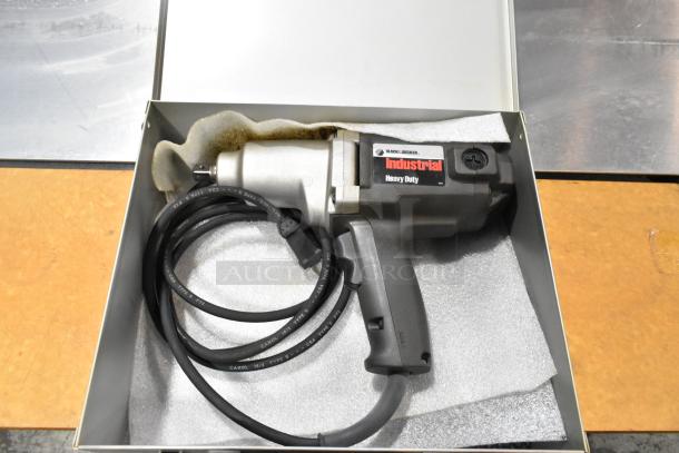 Black & Decker Industrial Heavy Duty Electric Power Tool in gray metal box, coiled cable; labeled for heavy-duty use.