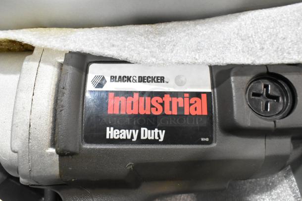 Black & Decker Industrial Heavy Duty power tool label in gray metal tool box, features durable construction.