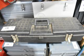 Contico black tool box with contents, shows signs of wear, metal latches, label marking "178 QTY" visible.