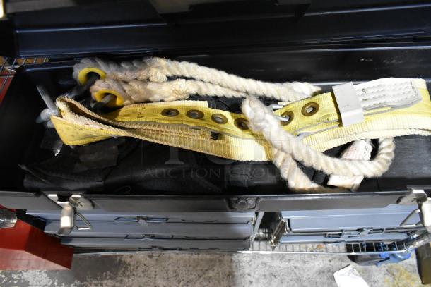 Contico black tool box with contents, including yellow strap, ropes, and hardware. Hinges intact, in good condition.