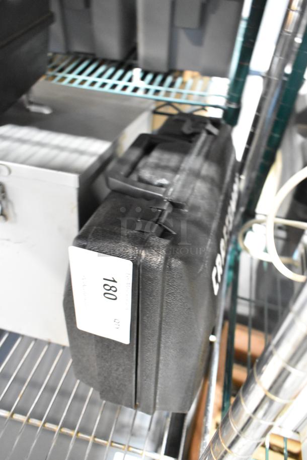 Craftsman black poly tool box containing an electric power tool, marked with item tag 180, in good condition.