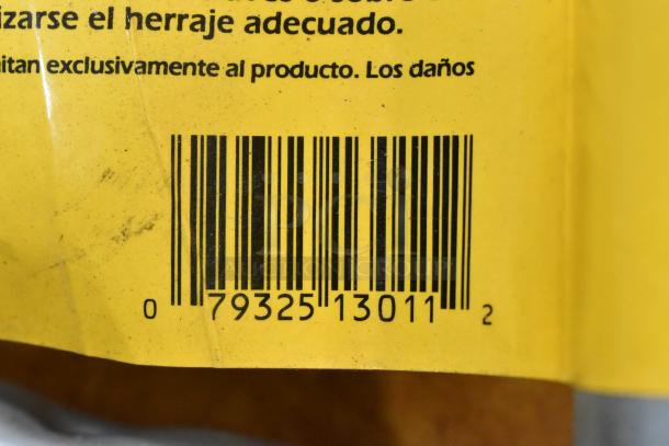 Barcode on a yellow package with Spanish text, part of a lot including a hose, Goldblatt panel carry, and wall storage hangers.