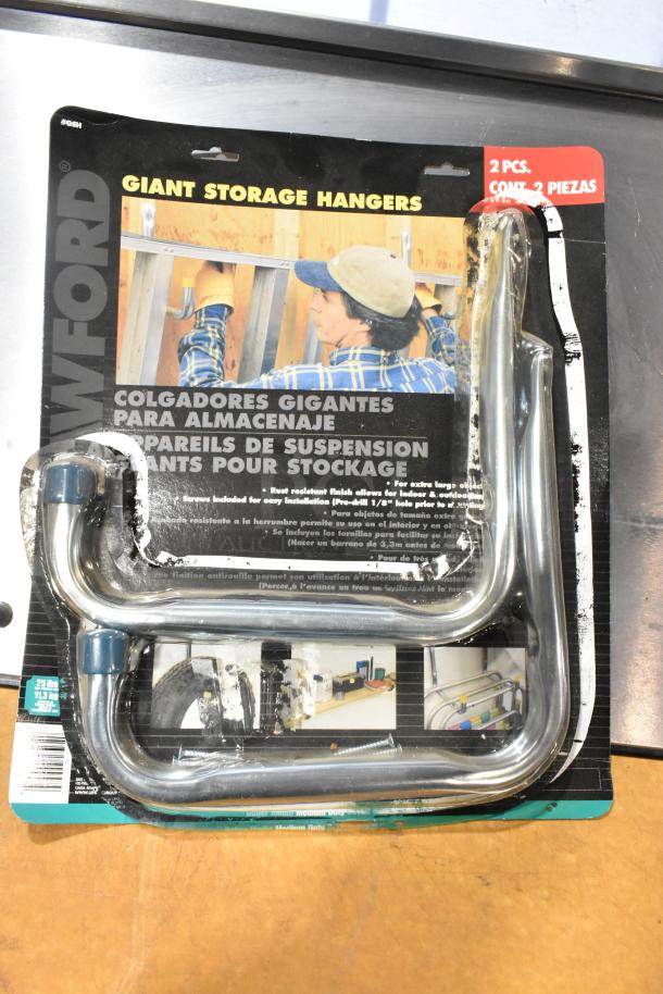 Crawford Giant Storage Hangers, 2 pcs, new in packaging; rust-resistant, for indoor/outdoor use, supports 25 lbs each.