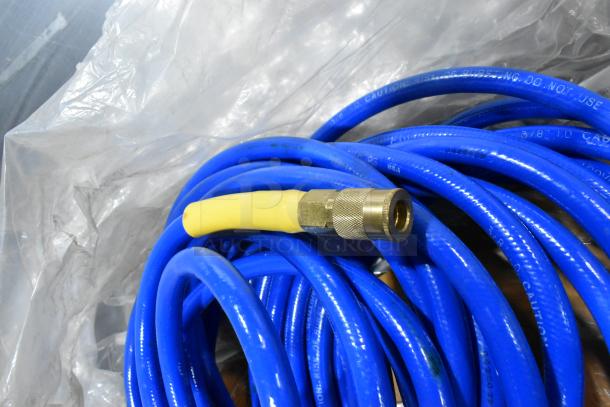 Blue hose coil with brass connector, part of tier lot including Goldblatt panel carry, wall hangers. Good condition.