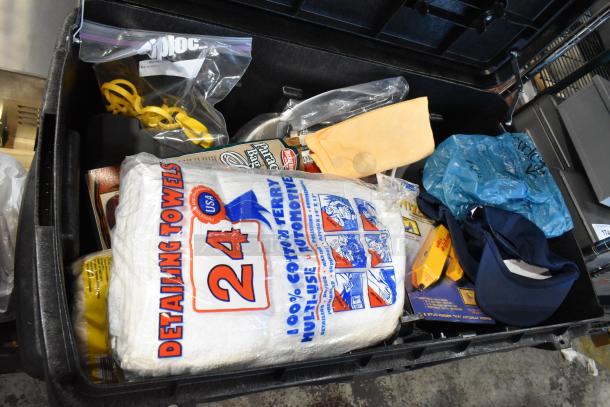 Pro Tuff Box tool box with detailing towels, assorted tools, and accessories. Features secure latches and spacious interior.