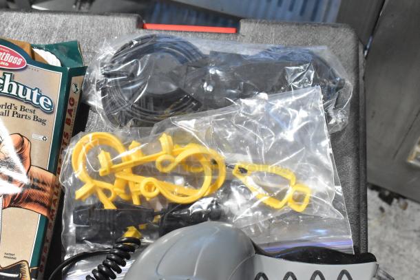 Pro Tuff Box tool box with contents, including plastic parts and towels, appears in good condition.