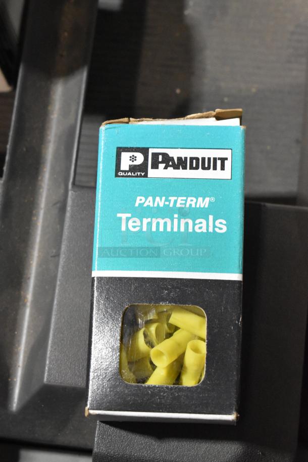 Panduit Pan-Term terminals box containing yellow connectors, partially opened, visible packaging.
