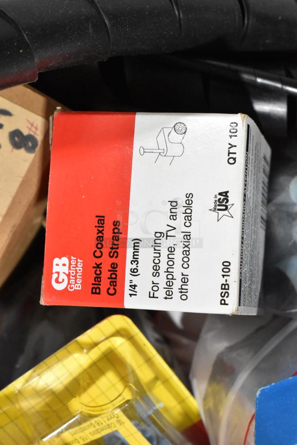 Pro Tuff Box Tool Box with contents including Gardner Bender coaxial cable straps. Box shows model PSB-100, made in USA.