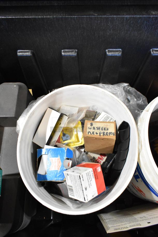 Pro Tuff Box tool box with contents, including various boxed items and towels, visible in good condition.