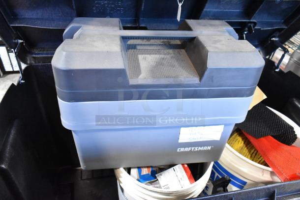 Pro Tuff Box Tool Box containing towels and assorted items, Craftsman brand, black and blue design, in good condition.