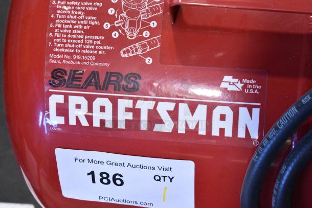 Craftsman 919-15209 Air Compressor, red, includes operational instructions, made in USA, good condition.