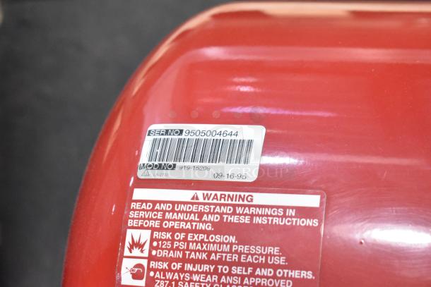 Craftsman 919-15209 air compressor with visible serial and model number label, moderate wear, max 125 PSI warning.
