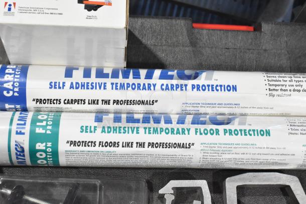 Trunk with FilmTech adhesive carpet and floor protectors, foam padding, and hardware. Includes fire blanket.