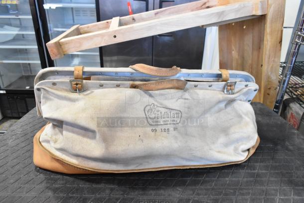 Goldblatt canvas tool bag with leather accents, used condition; includes trowels. Stamped with Goldblatt logo and model 09 122 HT.