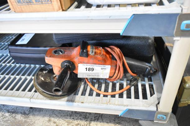 Black & Decker sander/polisher, 120V, 1 phase, orange. In used condition with visible label and attached power cord.