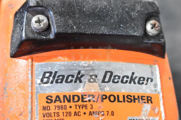 Black & Decker sander/polisher, model 7960, type 3, 120 volts, 7.0 amps, visible wear on orange casing, branded label.