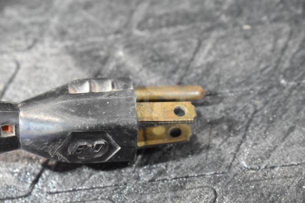 Close-up of a Black & Decker Sander/Polisher plug, showing its three-prong connector.