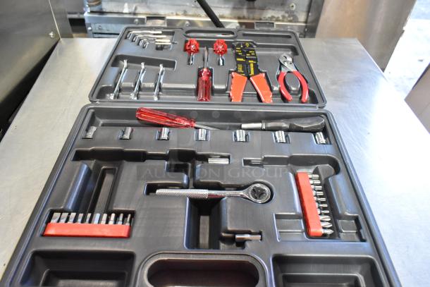Three hard black cases containing assorted tools including screwdrivers, pliers, and wrenches, in good condition.
