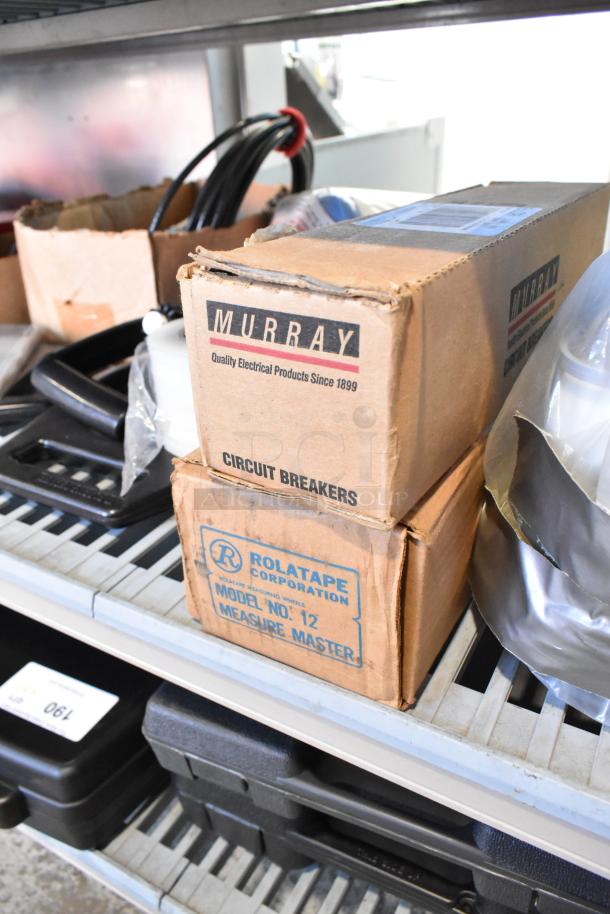 Tier lot featuring Murray Circuit Breakers box, Rolatape Model No. 12 box, poly bins, and rope. Various conditions.