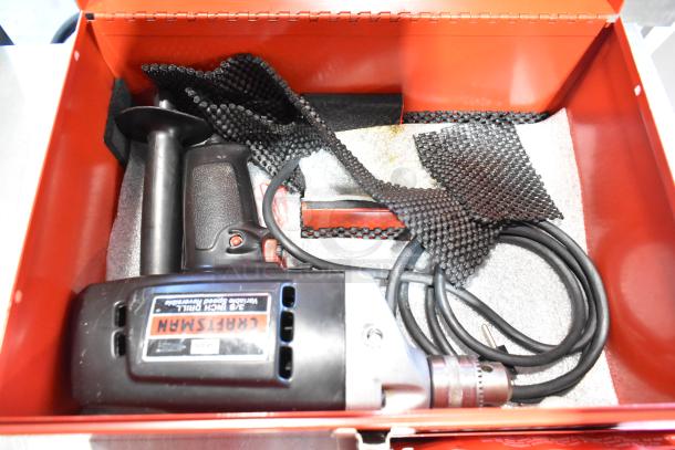 Craftsman 3/8 inch electric drill in red Milwaukee metal tool box, includes black handle and cord, used condition.
